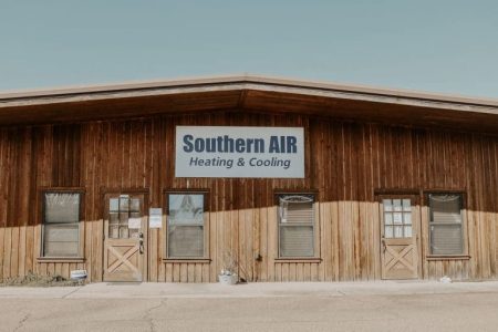 Southern AIR Heating & Cooling business storefront with wooden facade and multiple entrance doors in Ruston, Louisiana.